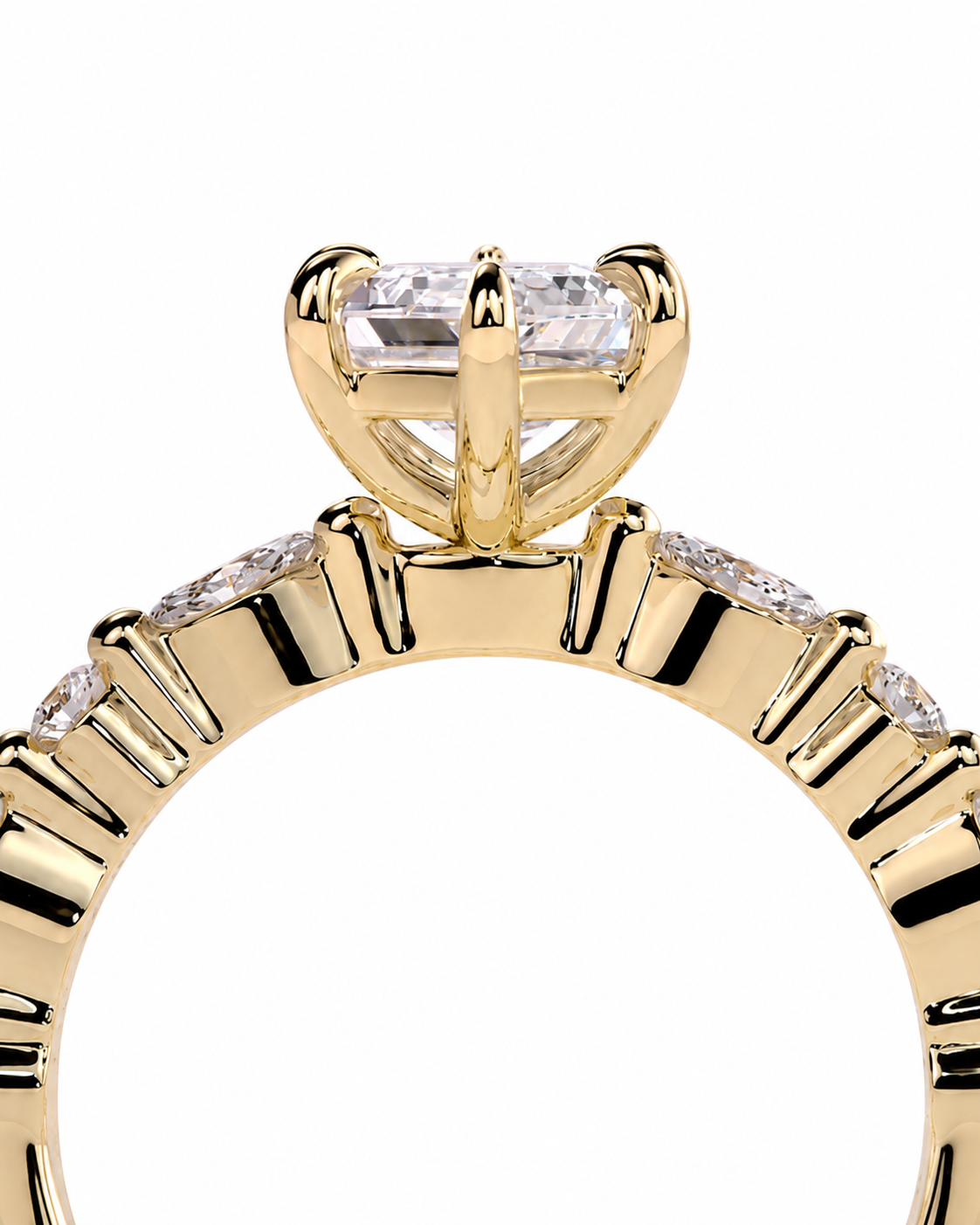 color_10K_YG, color_14K_YG &&Close-up of a yellow gold ring featuring a large rectangular clear gemstone in a prong setting, with smaller round stones along the band, shown on a white background.