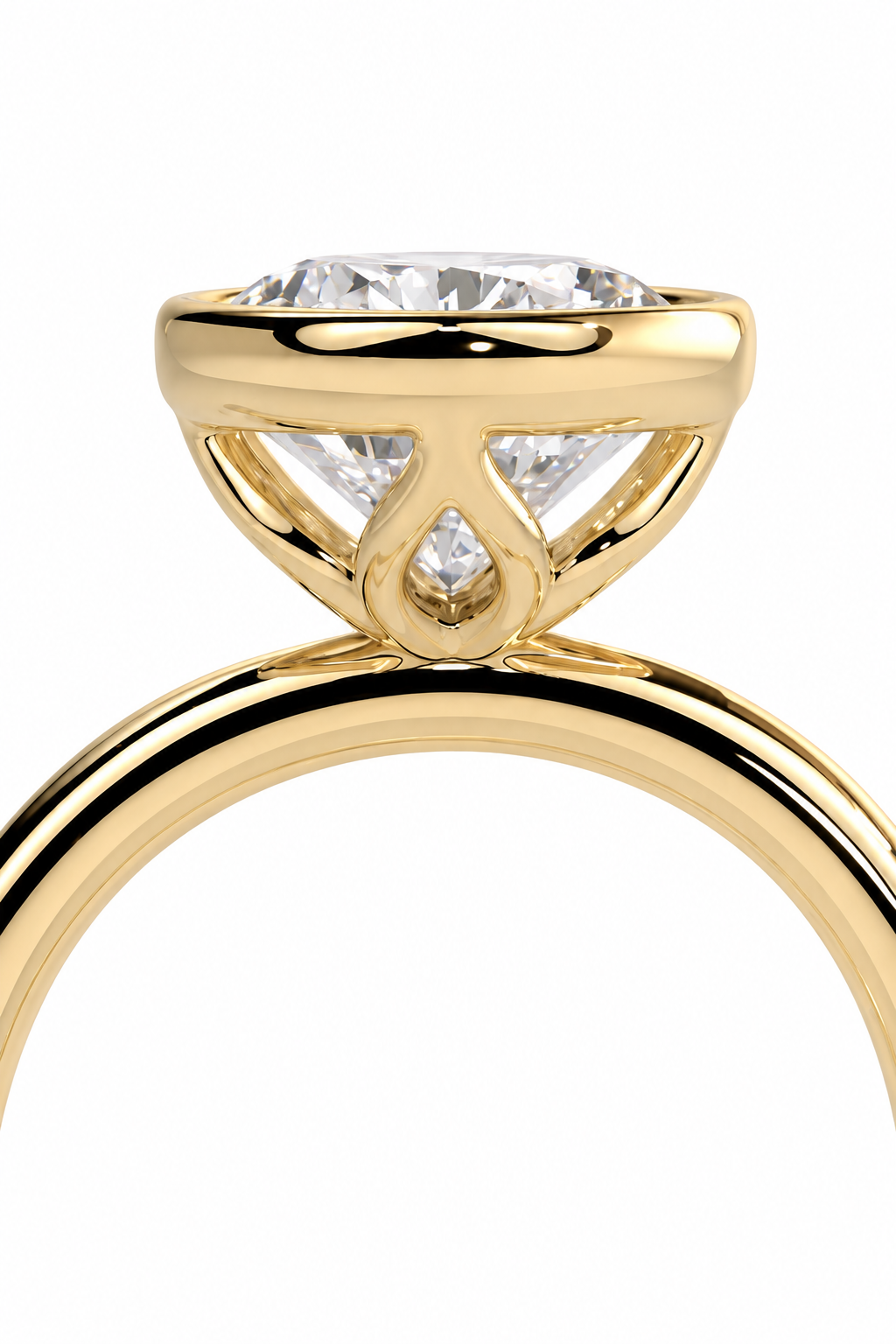 color_10K_YG, color_14K_YG &&A close-up of a yellow gold solitaire engagement ring with a round brilliant-cut diamond and a small pavé diamond below, set against a plain white background.