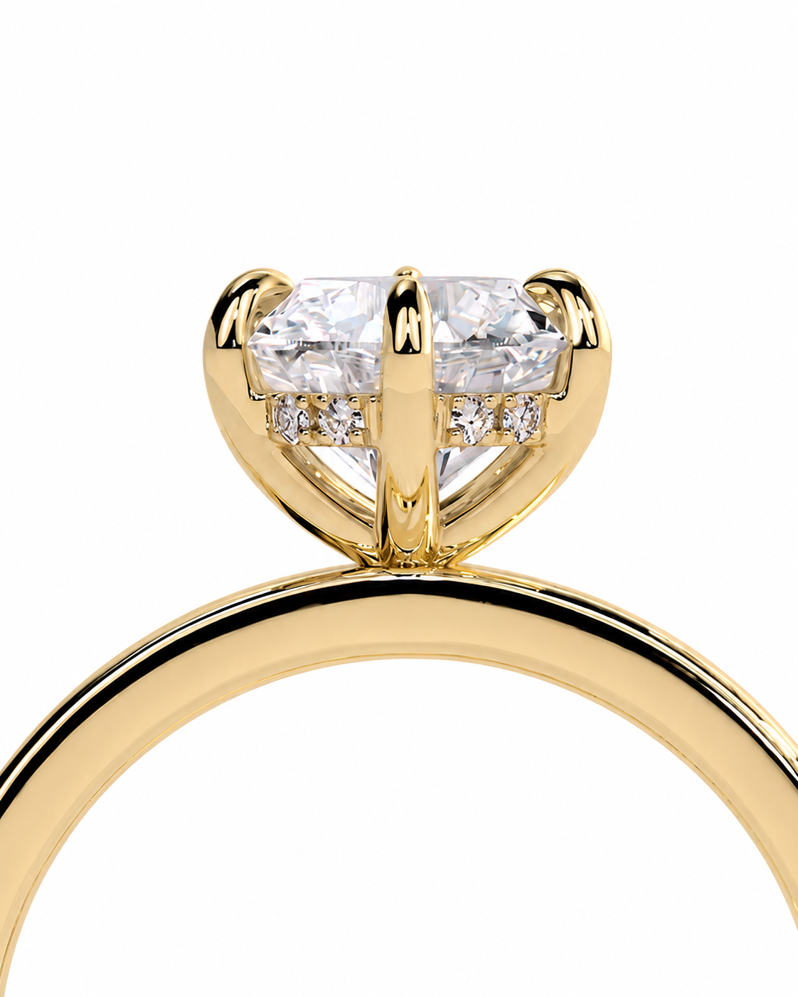 color_10K_YG, color_14K_YG &&A close-up shot of a yellow gold ring featuring a large oval-cut center stone in a prong setting, accented by small round stones on the band, set against a plain white background.