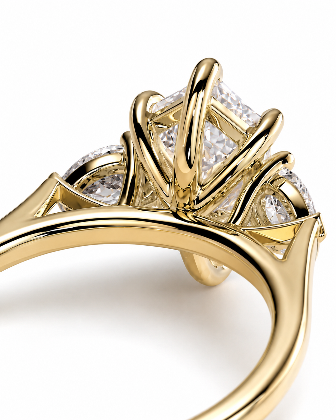 color_10K_YG, color_14K_YG &&A close-up of a yellow gold ring featuring a large rectangular center stone and smaller side stones, shown on a clean white background.