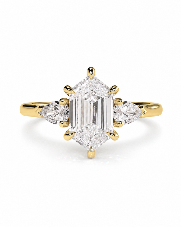 color_10K_YG, color_14K_YG &&A yellow gold ring featuring a large emerald-cut diamond center stone with smaller marquise-cut diamond side stones, set against a clean white background.