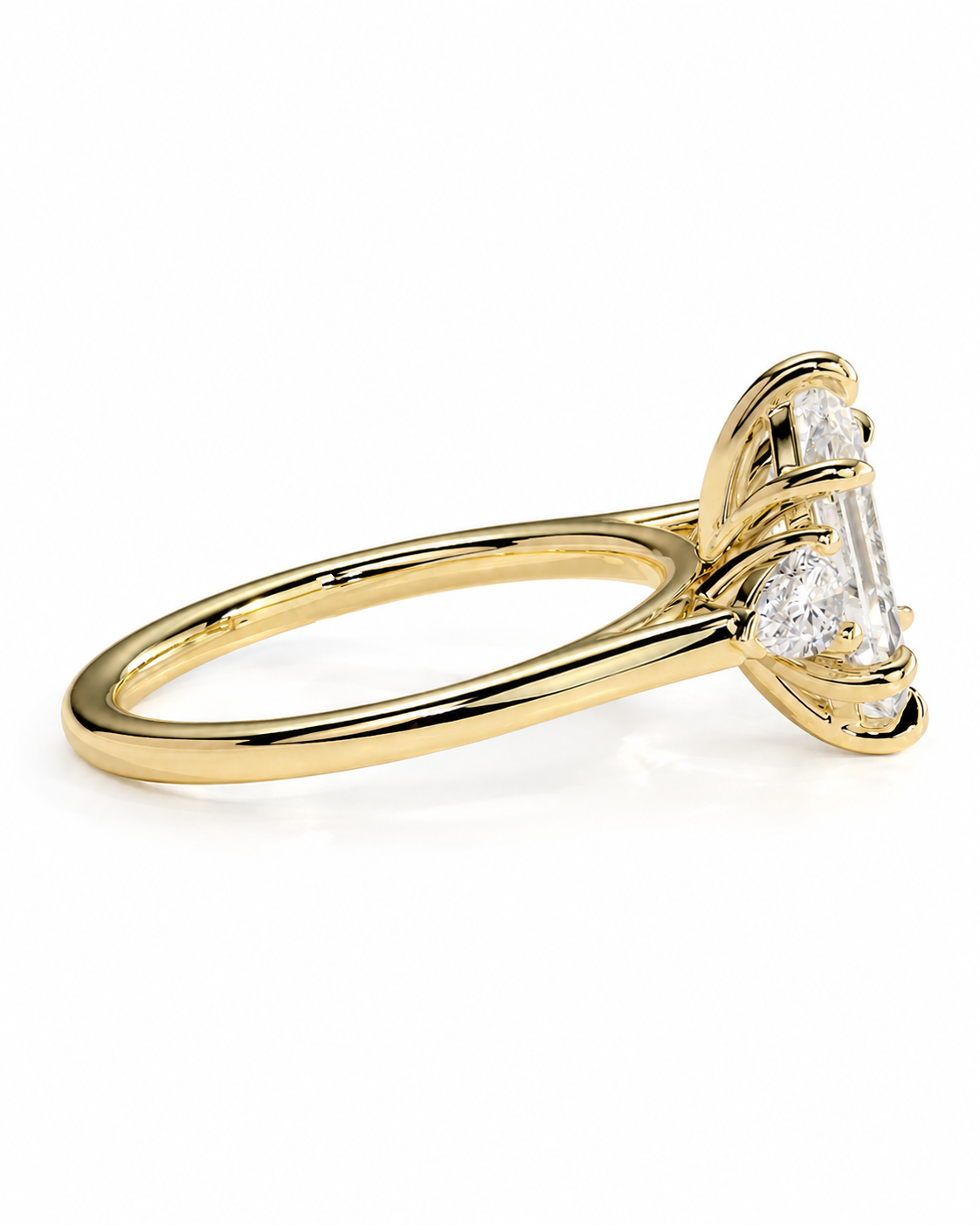 color_10K_YG, color_14K_YG &&A yellow gold ring with a three-stone diamond engagement setting, featuring a marquise-cut center stone and round side stones, shown on a clean white background.