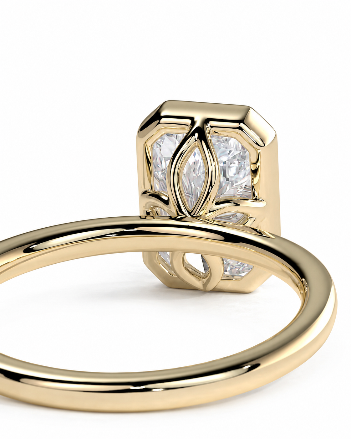color_10K_YG, color_14K_YG &&A close-up shot of a yellow gold ring featuring a geometric, multi-stone setting with marquise-cut and baguette-cut clear gemstones on a white background.