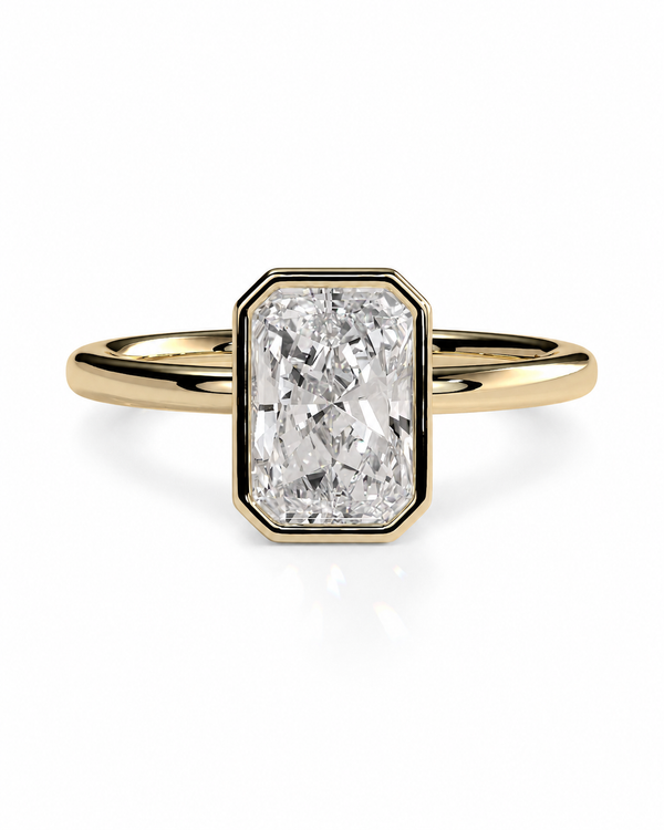 color_10K_YG, color_14K_YG &&A yellow gold ring featuring a rectangular emerald-cut diamond in an octagonal bezel setting, shown on a clean white background.