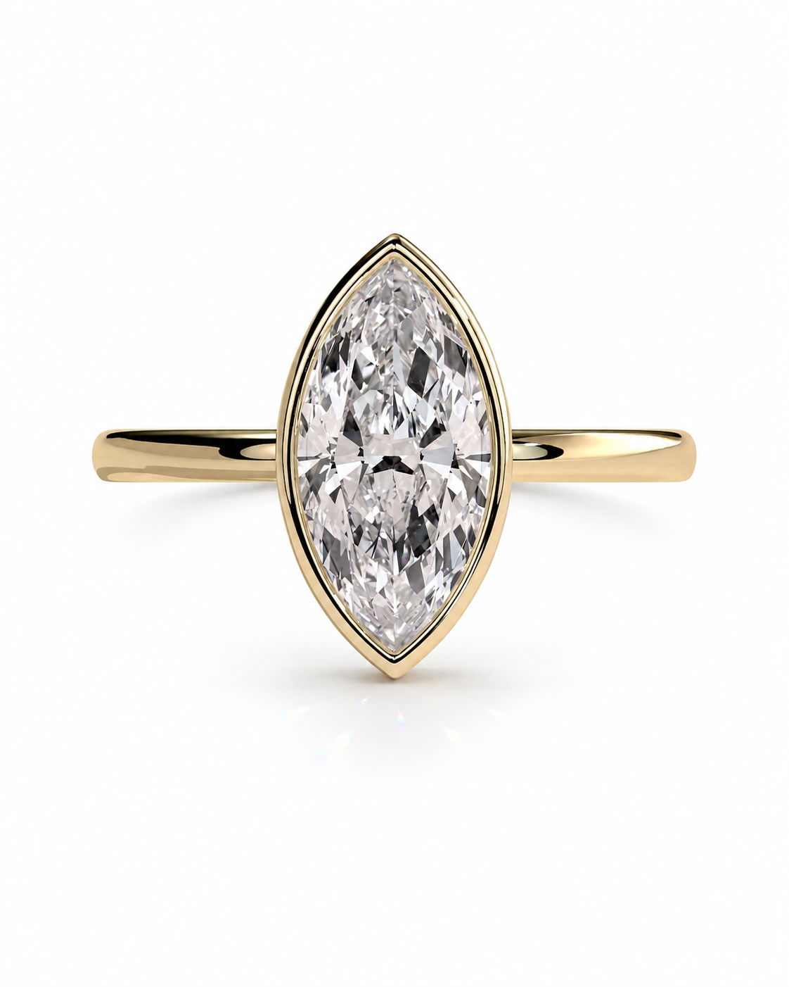 color_10K_YG, color_14K_YG &&A yellow gold ring featuring a marquise-cut clear gemstone in a bezel setting, shown against a plain white background.