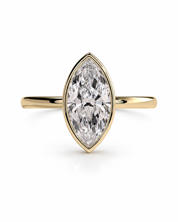 color_10K_YG, color_14K_YG &&A yellow gold ring featuring a marquise-cut clear gemstone in a bezel setting, shown against a plain white background.