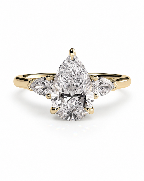 color_10K_YG, color_14K_YG &&A yellow gold ring featuring a pear-cut diamond center stone with marquise-cut side stones, shown on a clean white background.