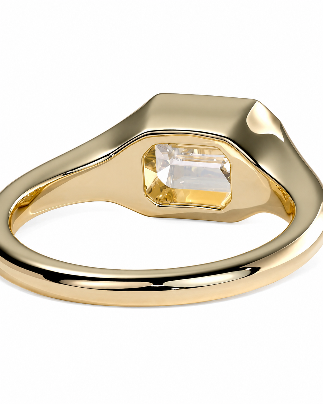 color_10K_YG, color_14K_YG &&A gold signet ring with a wide, polished band and a rectangular clear gemstone in a gold bezel setting, shown on a plain white background.