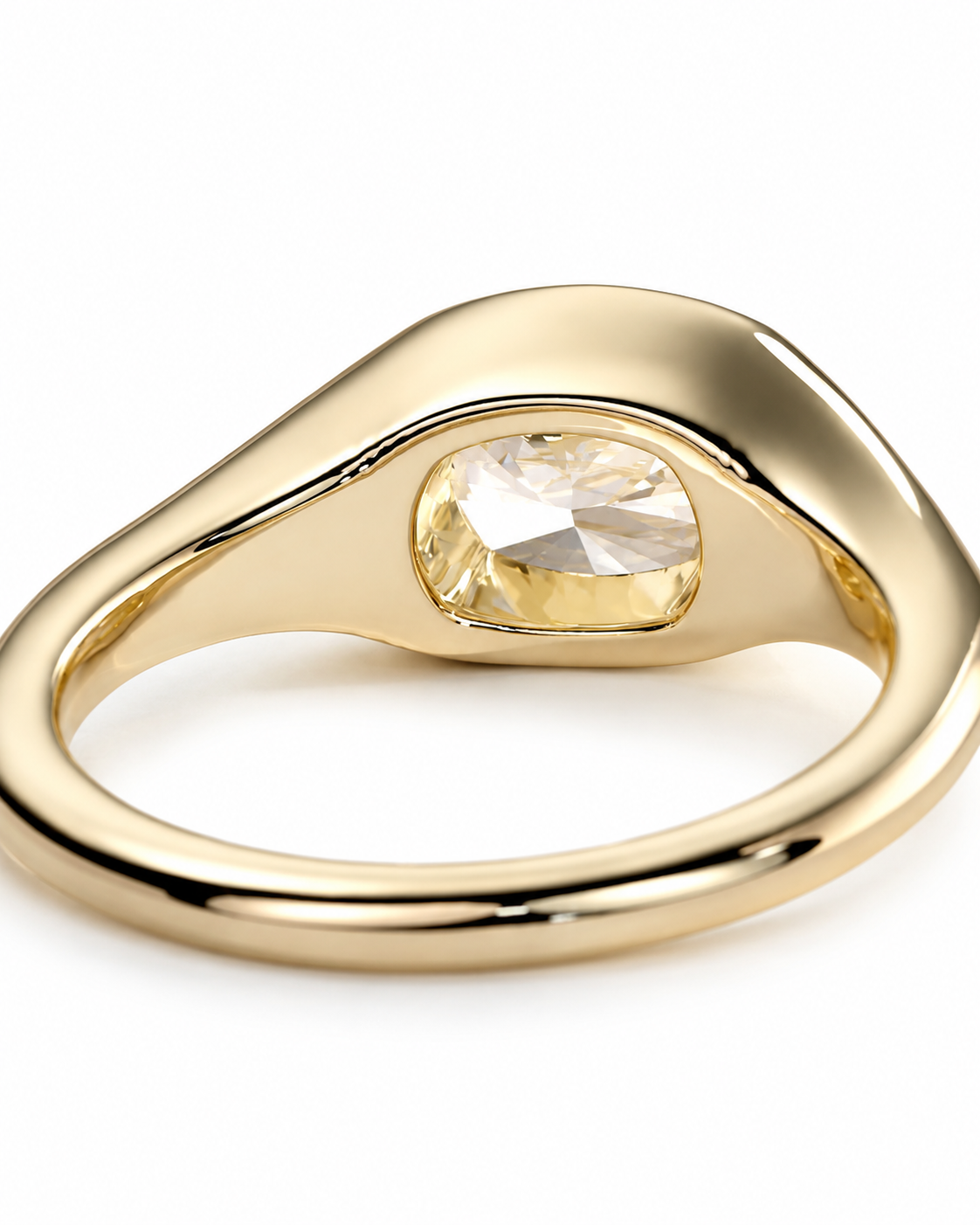 color_10K_YG, color_14K_YG &&A polished gold ring featuring a large, bezel-set oval clear gemstone on a clean white background.