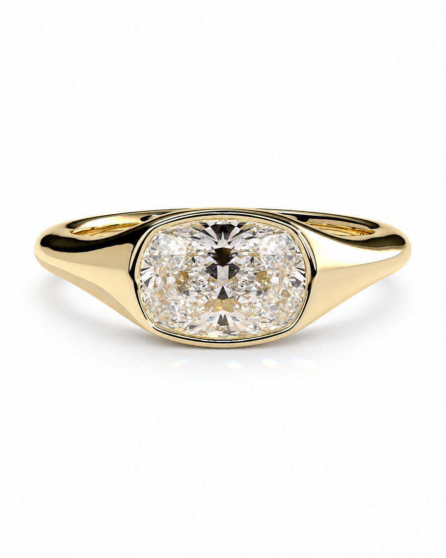 color_10K_YG, color_14K_YG &&A yellow gold ring featuring a large cushion-cut diamond in a bezel setting, shown on a clean white background.