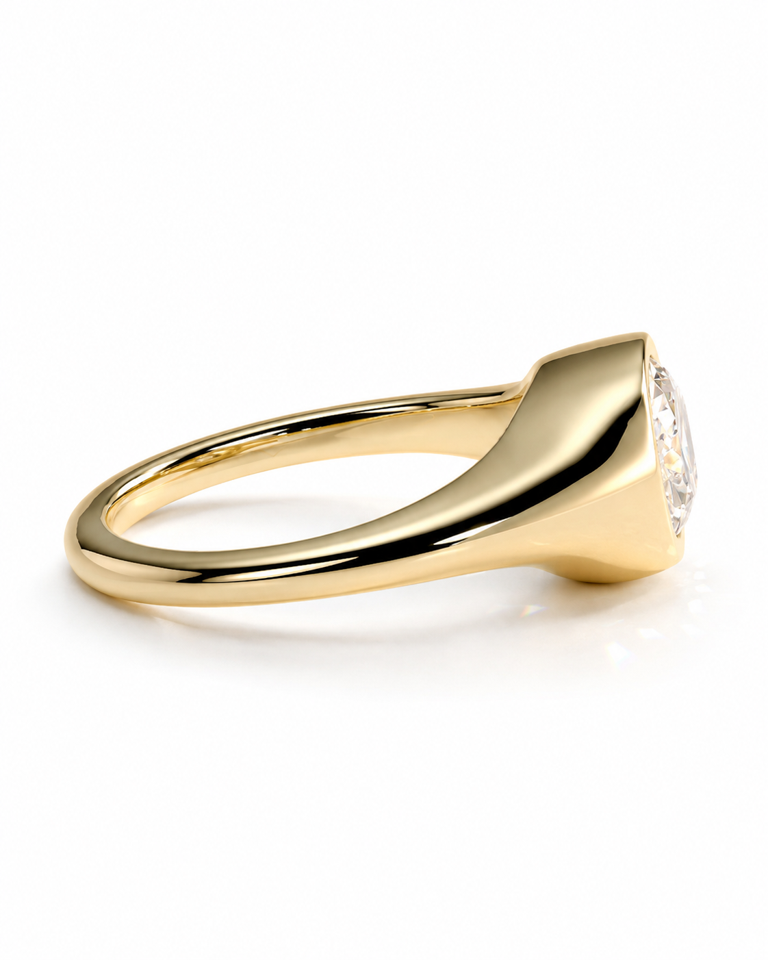 color_10K_YG, color_14K_YG &&A polished yellow gold signet ring with a clear round gemstone, shown from a side profile on a clean white background.