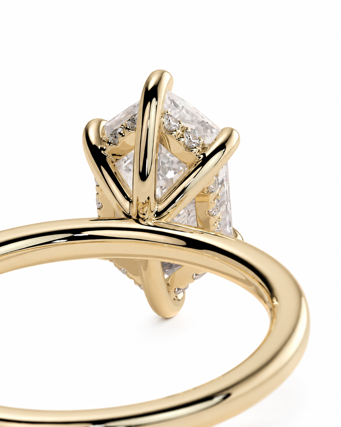 color_10K_YG, color_14K_YG &&A close-up of a yellow gold ring featuring a large clear rectangular gemstone in a prong setting, with small accent stones along the band, shown on a white background.