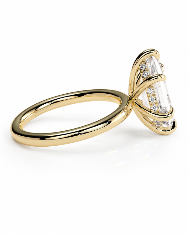 color_10K_YG, color_14K_YG &&A yellow gold ring featuring a marquise-cut clear center stone in a prong setting, accented with smaller round diamonds along the sides, shown on a clean white background.