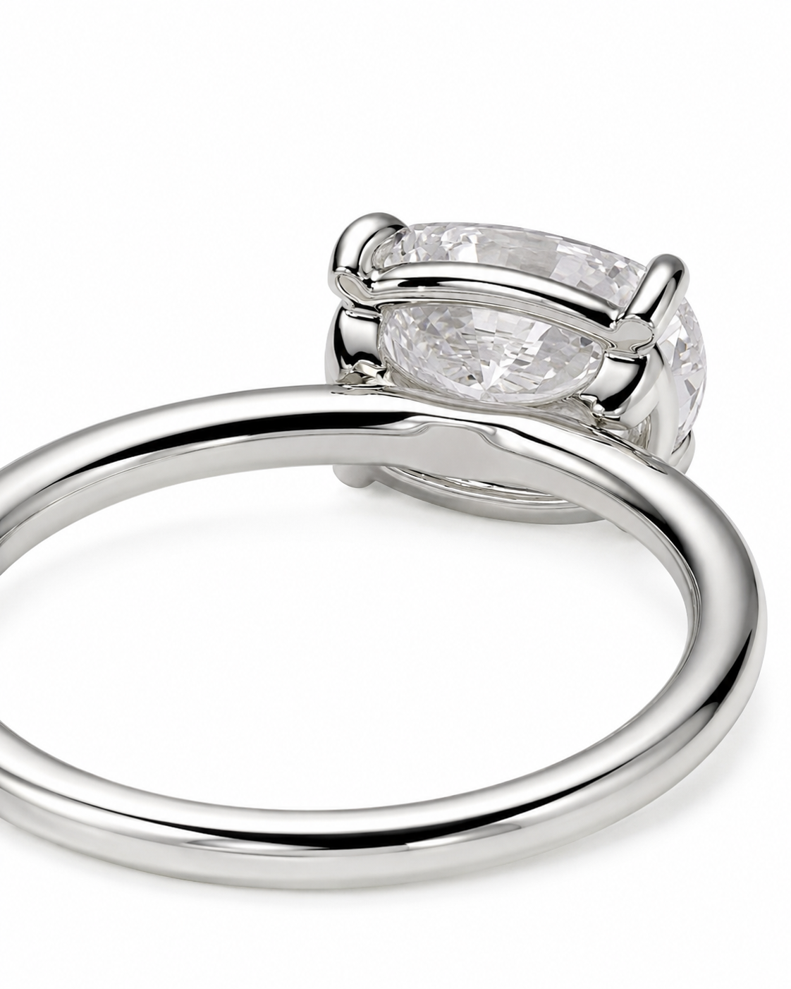 color_925_SIL,color_935_ARG,color_10K_WG, color_14K_WG &&
A close-up shot of a polished silver-tone ring featuring a large, clear oval-cut gemstone in a prong setting, shown against a plain white background.