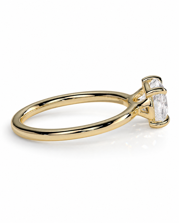 color_10K_YG, color_14K_YG &&
A yellow gold solitaire engagement ring featuring a rectangular emerald-cut clear gemstone in a four-prong setting, shown on a clean white background.