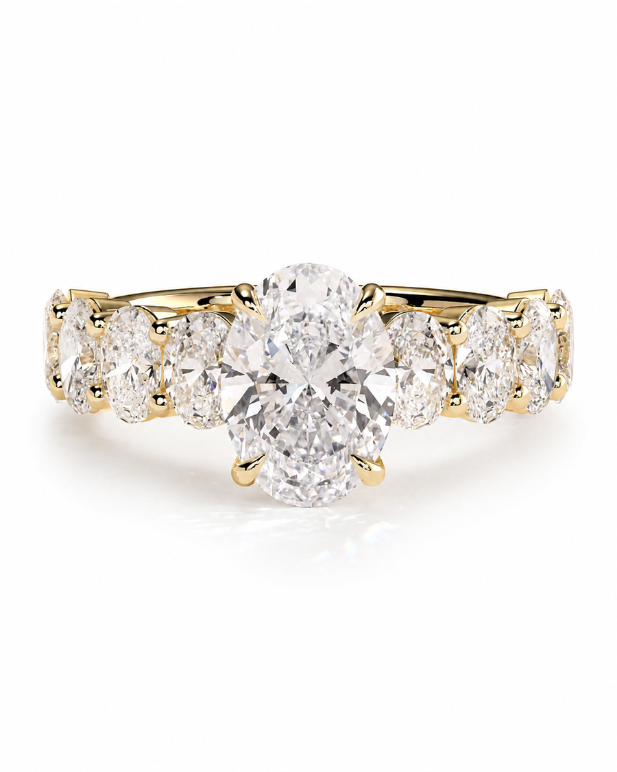 color_10K_YG, color_14K_YG &&A yellow gold five-stone ring featuring a large oval center diamond flanked by four round brilliant diamonds on a clean white background.