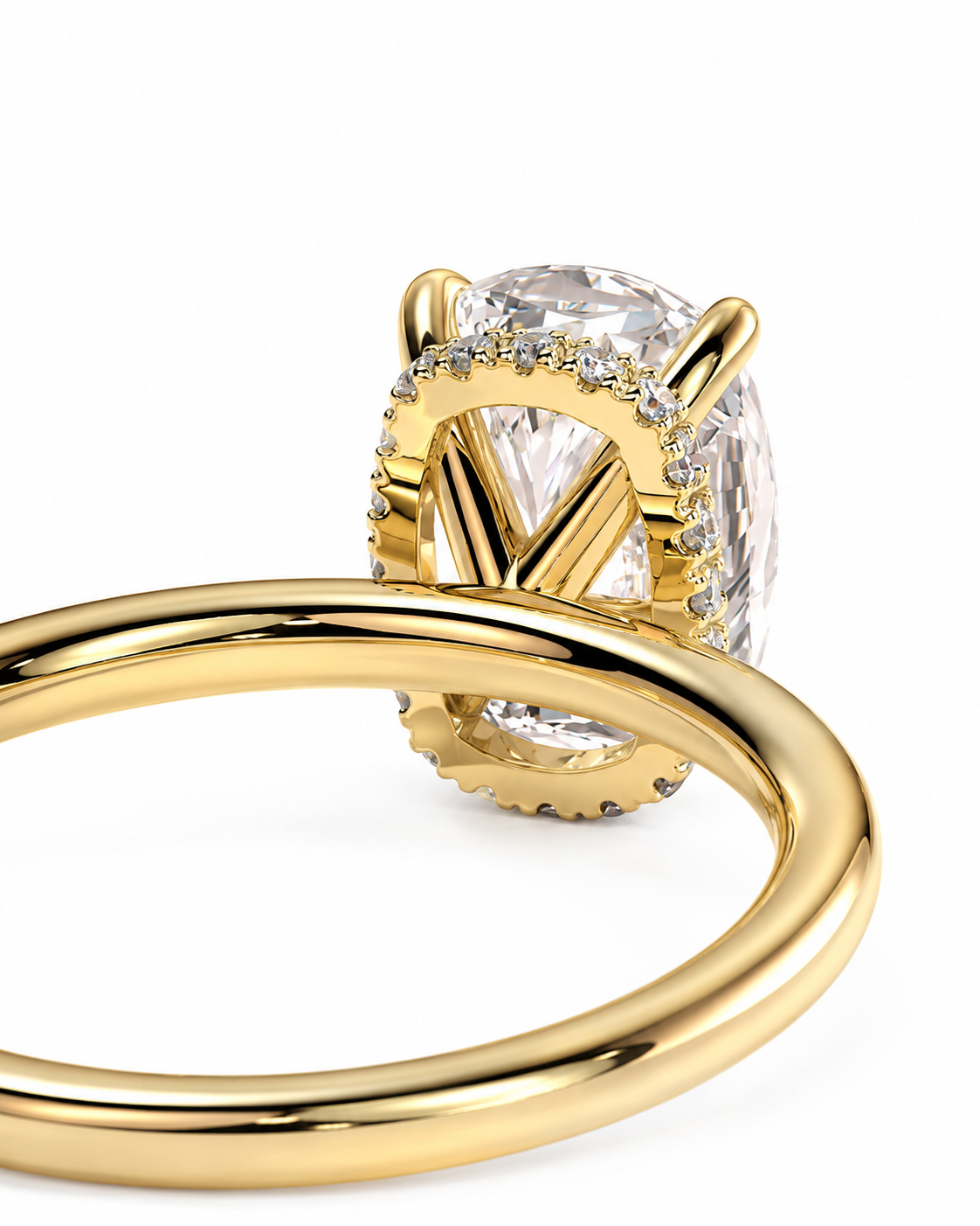 color_10K_YG, color_14K_YG &&A close-up of a yellow gold ring featuring a large oval clear gemstone in a prong setting with small accent stones along the halo, shown on a white background.