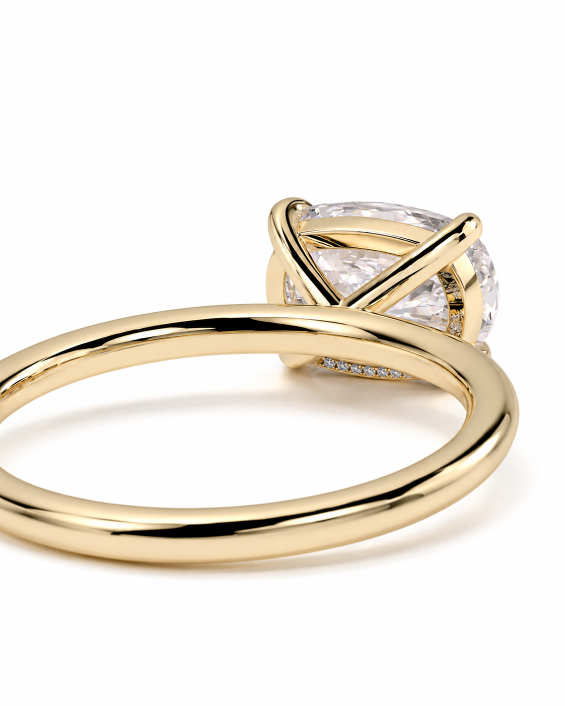 color_10K_YG, color_14K_YG &&A close-up shot of a gold ring with a clear, cushion-cut gemstone in a prong setting, on a plain white background.