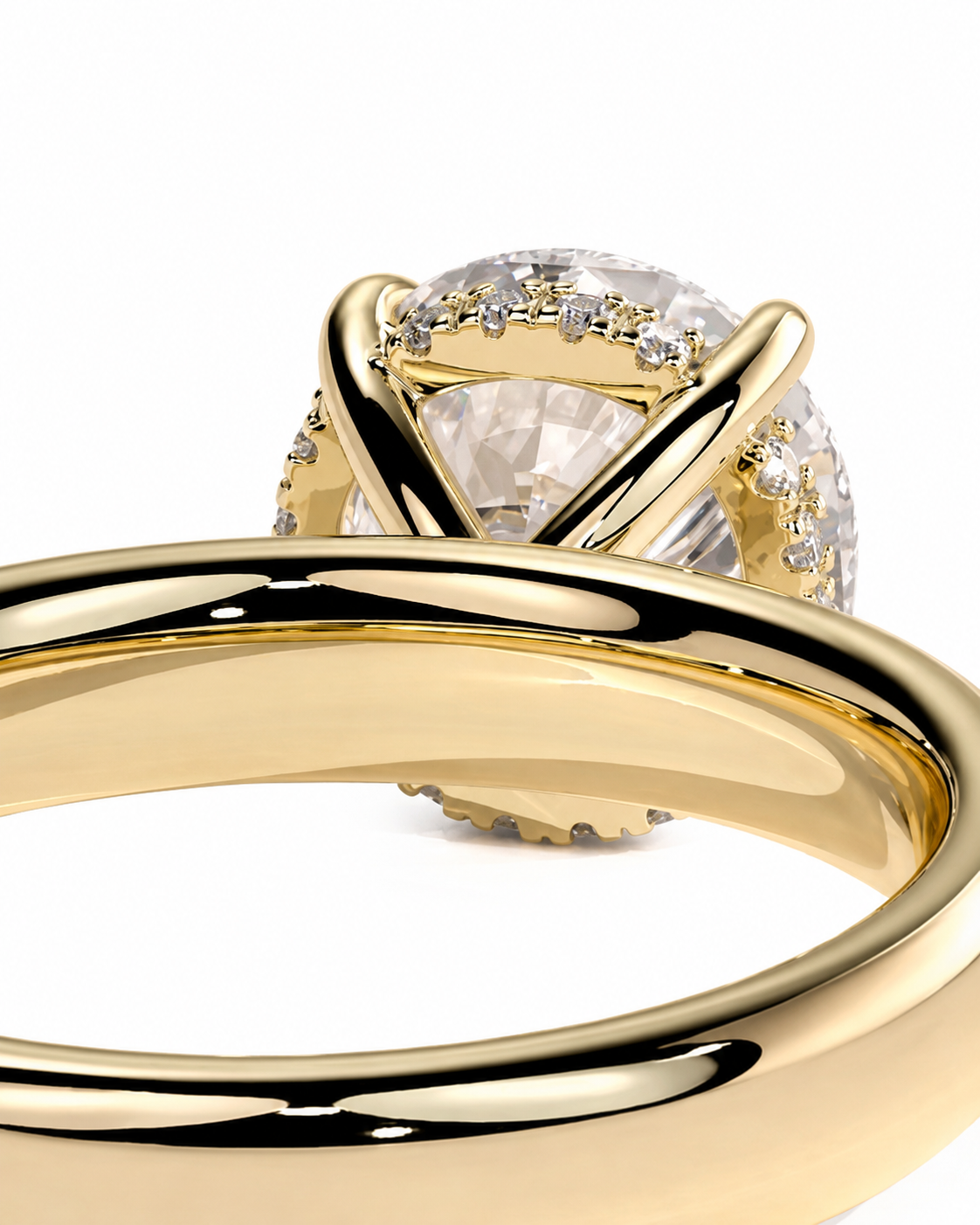 color_10K_YG, color_14K_YG &&A close-up of a yellow gold ring with a large oval clear gemstone in a prong setting, accented by smaller side stones, on a white background.