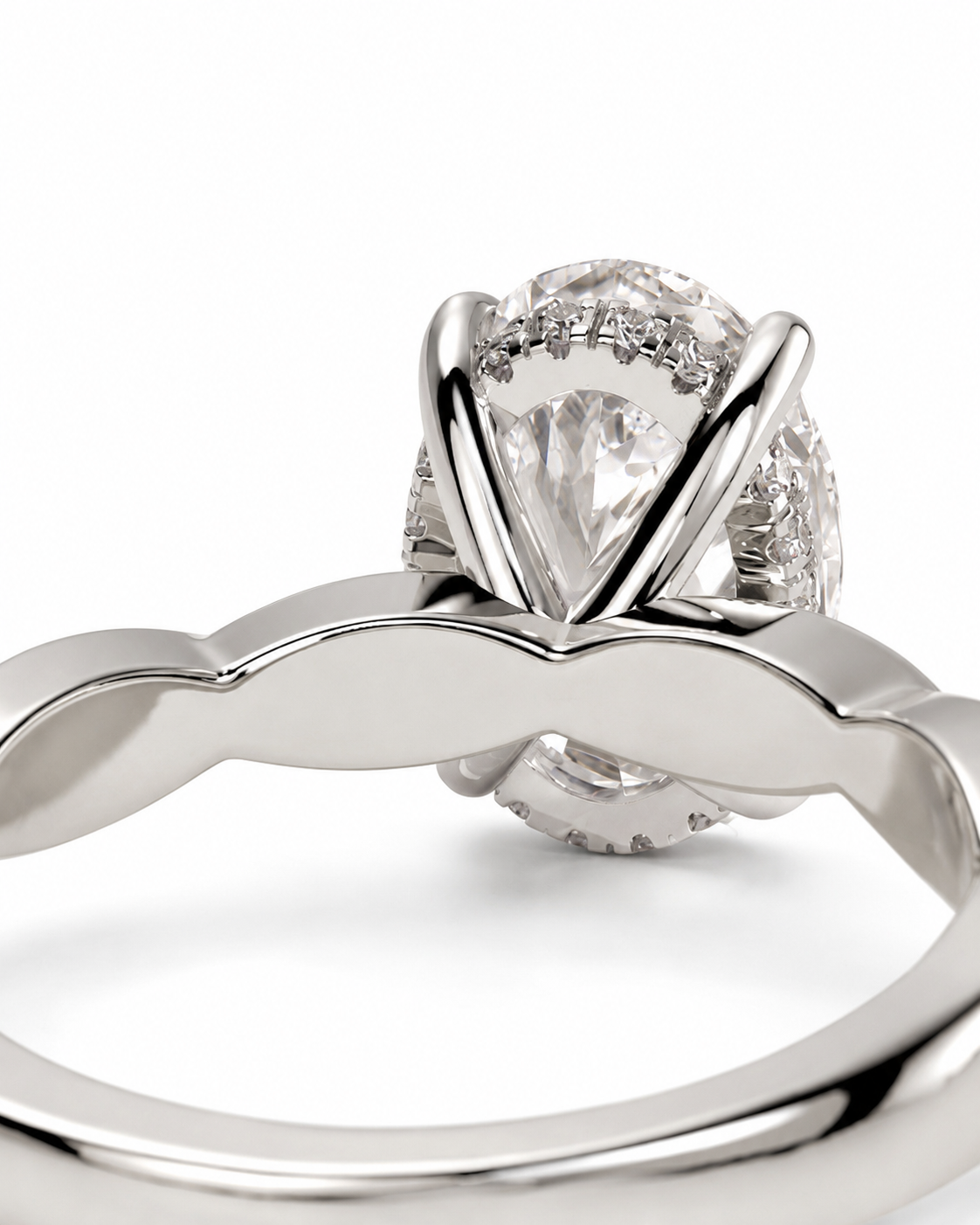 color_925_SIL,color_935_ARG,color_10K_WG, color_14K_WG &&
A close-up studio shot of a silver-toned ring with a large clear teardrop-shaped center stone and smaller stones along the shoulders, set against a plain white background.