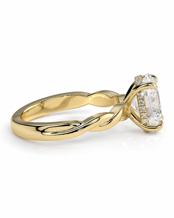 color_10K_YG, color_14K_YG &&
A yellow gold twisted band ring featuring a large rectangular clear gemstone in a prong setting with small accent stones along the side, shown on a clean white background.