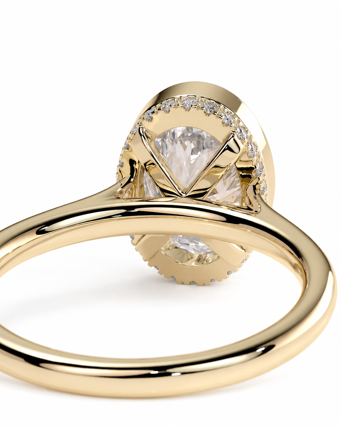 color_10K_YG, color_14K_YG &&
A close-up shot of a yellow gold ring featuring a large oval-cut clear center stone surrounded by a halo of small round stones, set on a polished gold band against a white background.