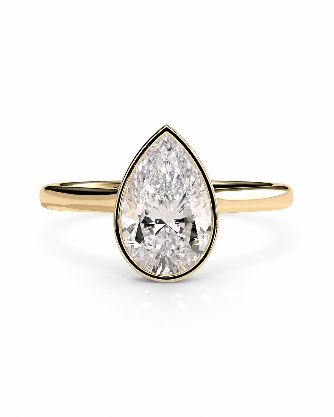 color_10K_YG, color_14K_YG &&A pear-cut diamond engagement ring in a yellow gold setting and band, shown on a clean white background.