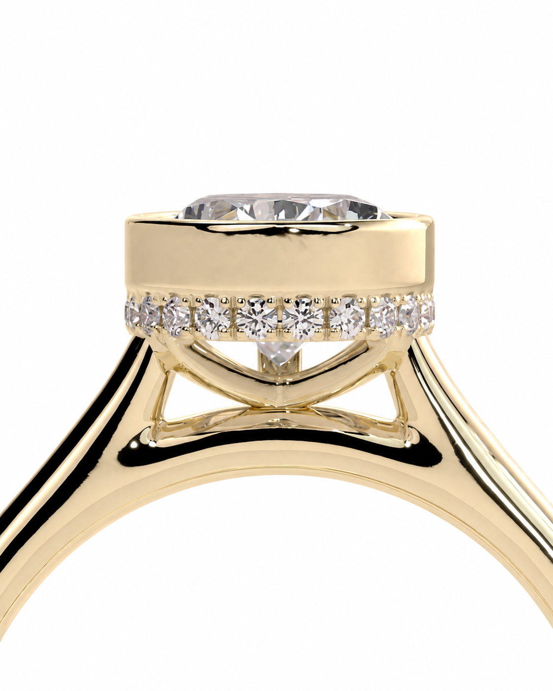 color_10K_YG, color_14K_YG &&A close-up of a yellow gold ring with a round clear gemstone in a prong setting, accented by a row of small clear stones around the band, on a white background.