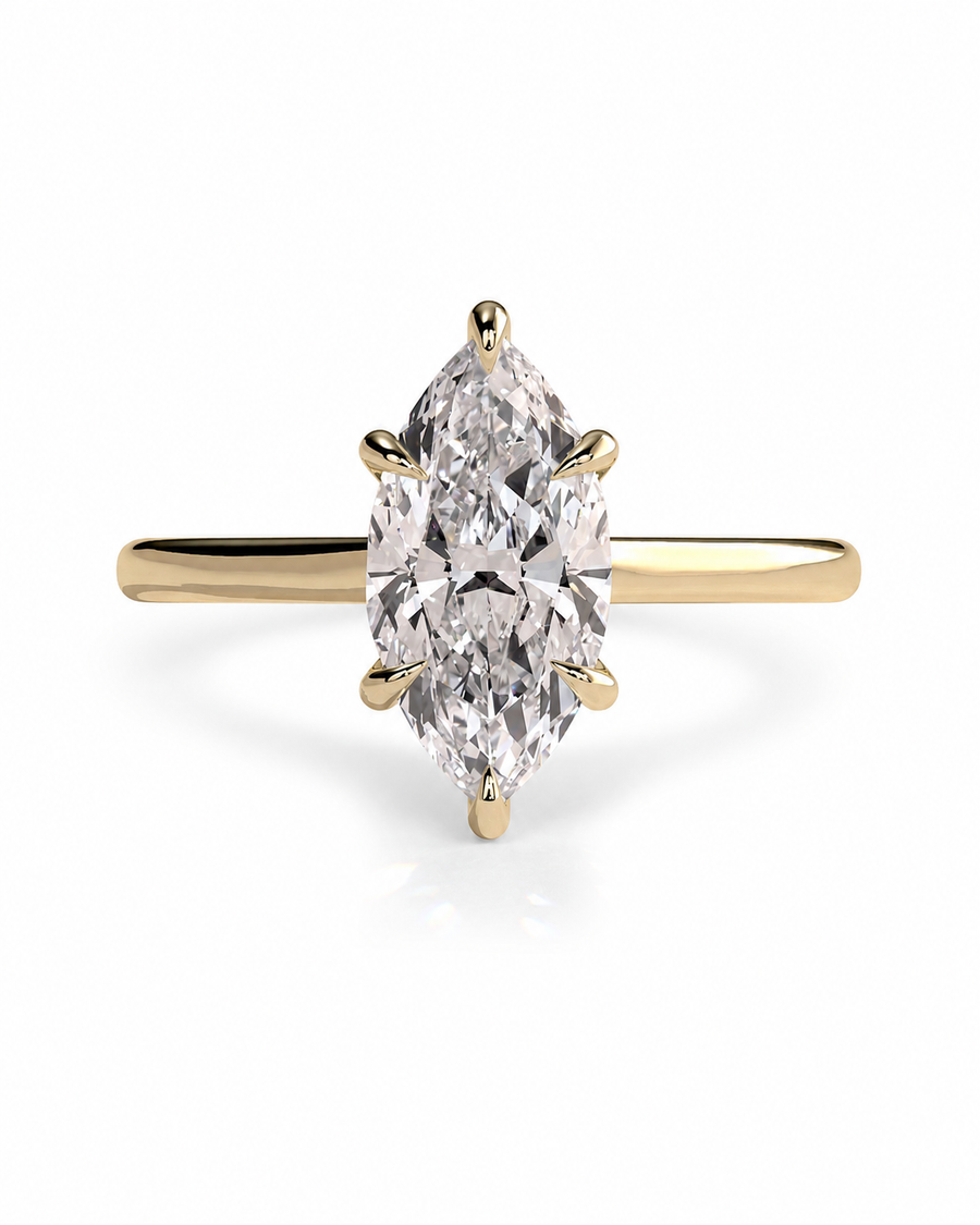 color_10K_YG, color_14K_YG &&A yellow gold ring featuring a marquise-cut diamond center stone in a four-prong setting, shown on a clean white background.