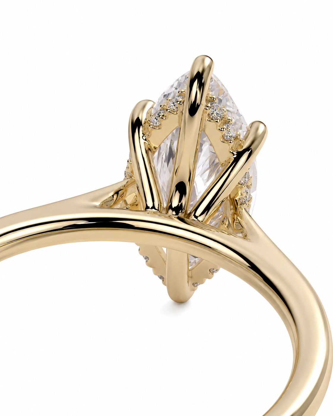color_10K_YG, color_14K_YG &&A close-up of a yellow gold ring featuring a marquise-cut clear center stone with small accent stones, shown on a plain white background.