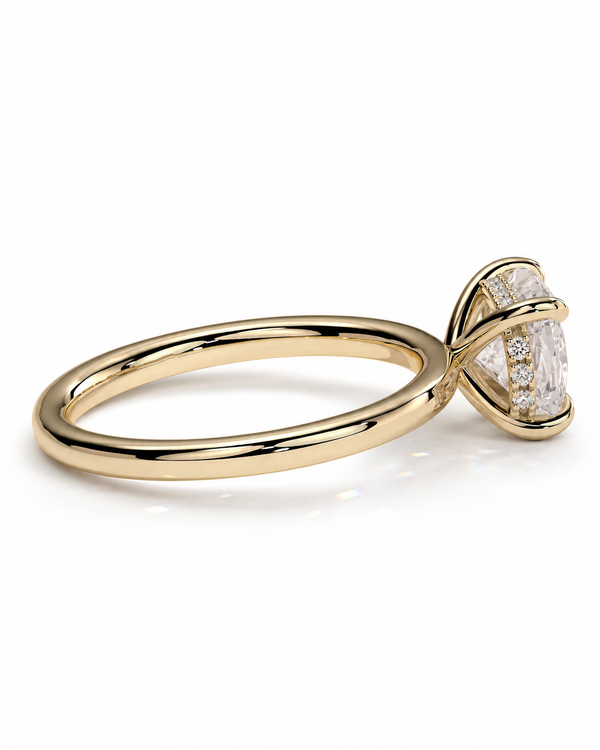 color_10K_YG, color_14K_YG &&A yellow gold solitaire engagement ring featuring a large cushion-cut clear gemstone in a prong setting, shown on a clean white background.