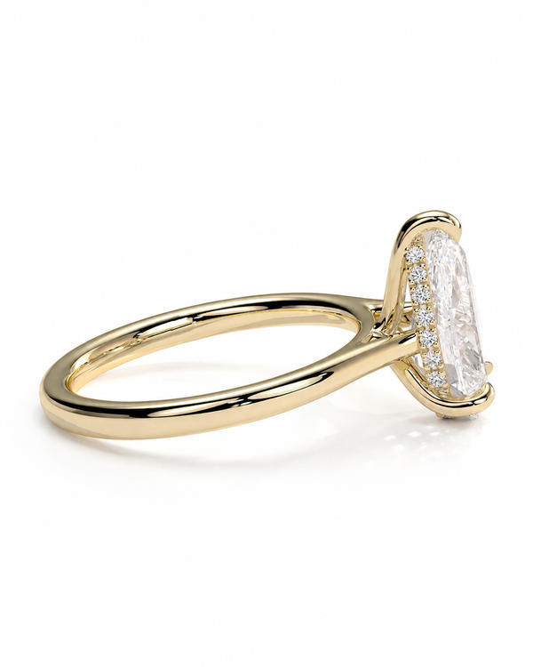 color_10K_YG, color_14K_YG &&A yellow gold ring featuring a large oval-cut clear gemstone in a prong setting, accented by a halo of small round stones on the band, shown against a plain white background.