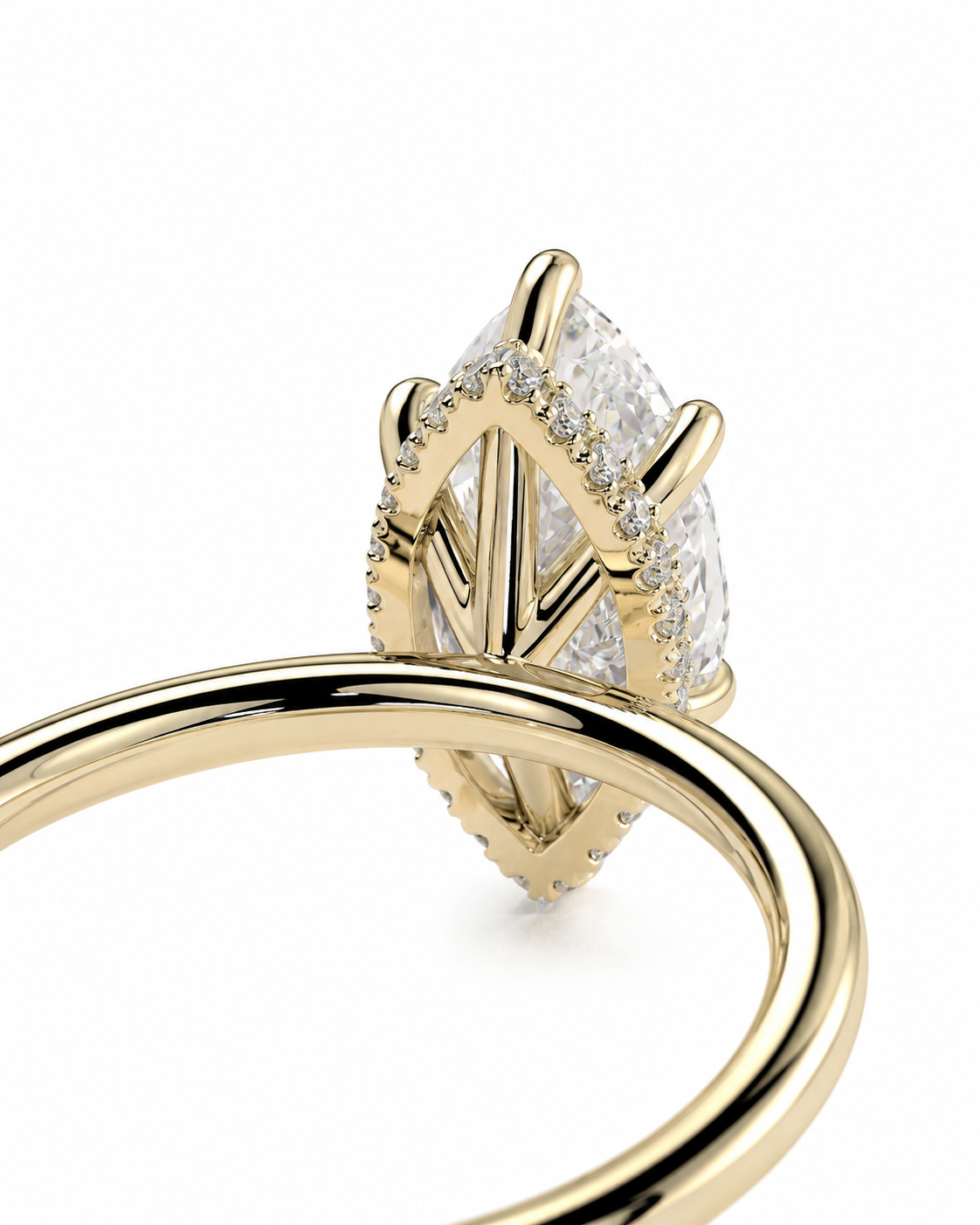 color_10K_YG, color_14K_YG &&A close-up of a gold ring featuring a marquise-cut clear gemstone in a geometric prong setting, accented with small pavé diamonds, on a white background.