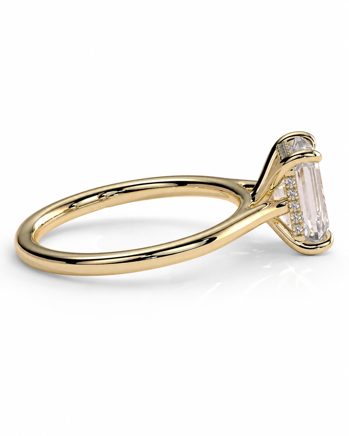color_10K_YG, color_14K_YG &&A yellow gold ring featuring a large rectangular baguette-cut clear gemstone in a prong setting, accented by small round stones along the side, shown on a clean white background.