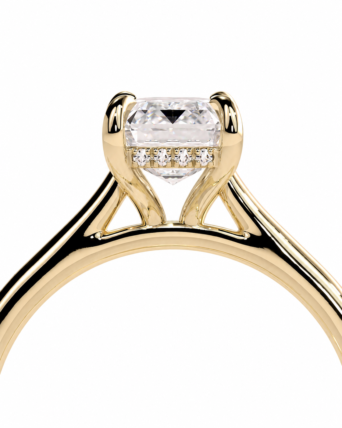 color_10K_YG, color_14K_YG &&A close-up of a yellow gold solitaire engagement ring featuring a rectangular clear center stone and a row of small accent diamonds on the band, set against a plain white background.