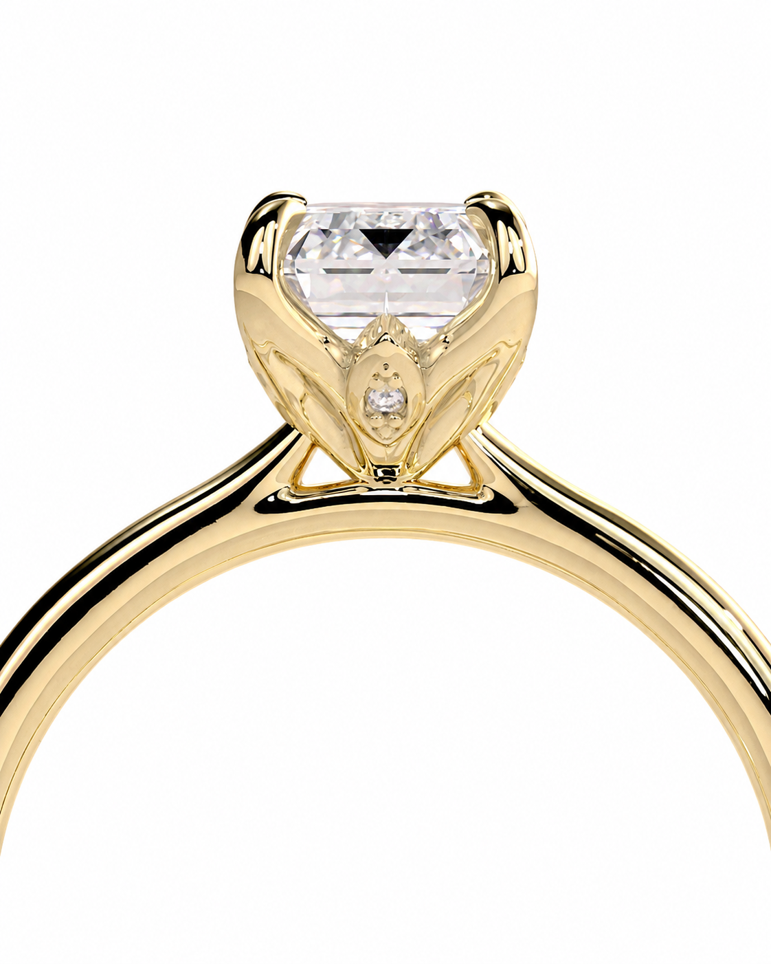 color_10K_YG, color_14K_YG &&A close-up of a yellow gold solitaire engagement ring with a clear rectangular gemstone in a decorative crown setting, shown on a plain white background.