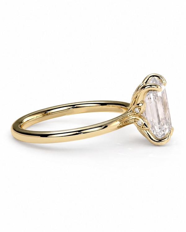 color_10K_YG, color_14K_YG &&A yellow gold ring featuring a large rectangular clear baguette-cut gemstone in a prong setting, with small accent diamonds on the shoulders, shown on a clean white background.