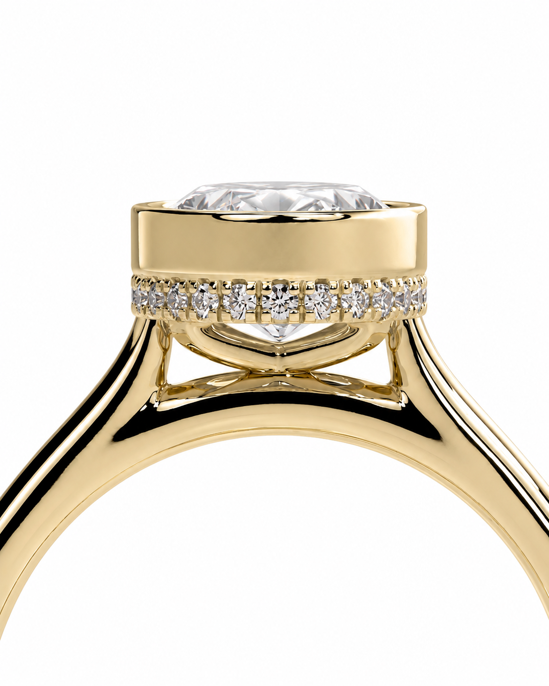 color_10K_YG, color_14K_YG &&
A close-up studio shot of a yellow gold ring with a round brilliant-cut center stone and a row of small pave-set diamonds along the band, shown against a plain white background.