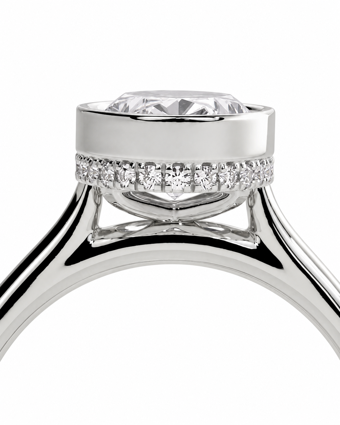 color_925_SIL,color_935_ARG,color_10K_WG, color_14K_WG &&
A close-up studio shot of a silver-toned diamond ring featuring a round brilliant-cut center stone and a halo of small diamonds on the band, set against a plain white background.