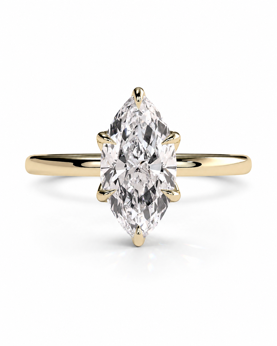 color_10K_YG, color_14K_YG &&A yellow gold ring featuring a marquise-cut diamond in a prong setting, shown on a clean white background.
