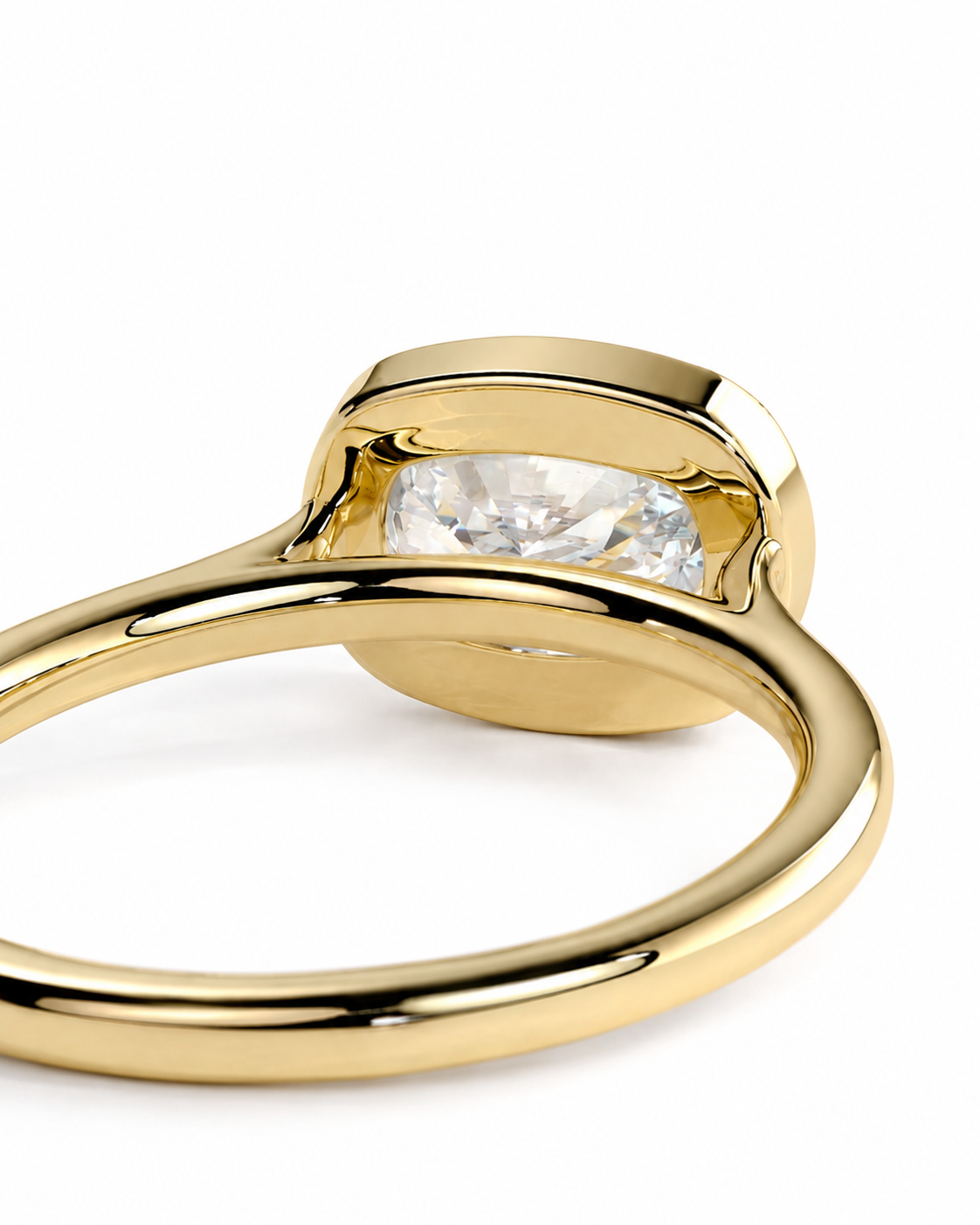 color_10K_YG, color_14K_YG &&A close-up shot of a polished yellow gold ring featuring a marquise-cut clear gemstone in a bezel setting, shown against a seamless white background.