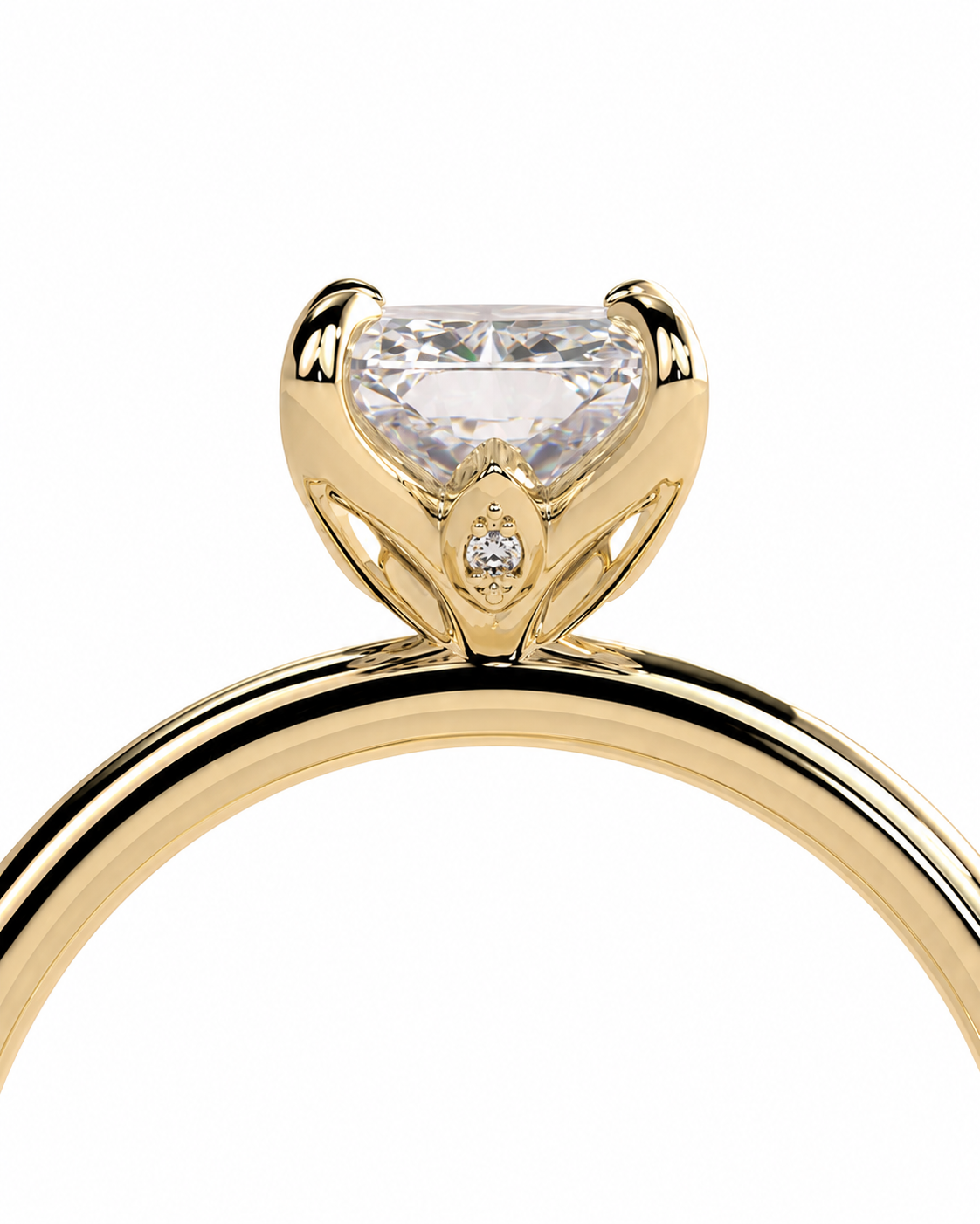 color_10K_YG, color_14K_YG &&A close-up of a yellow gold solitaire engagement ring featuring a large cushion-cut clear gemstone in a prong setting with a small accent diamond on the band, set against a plain white background.