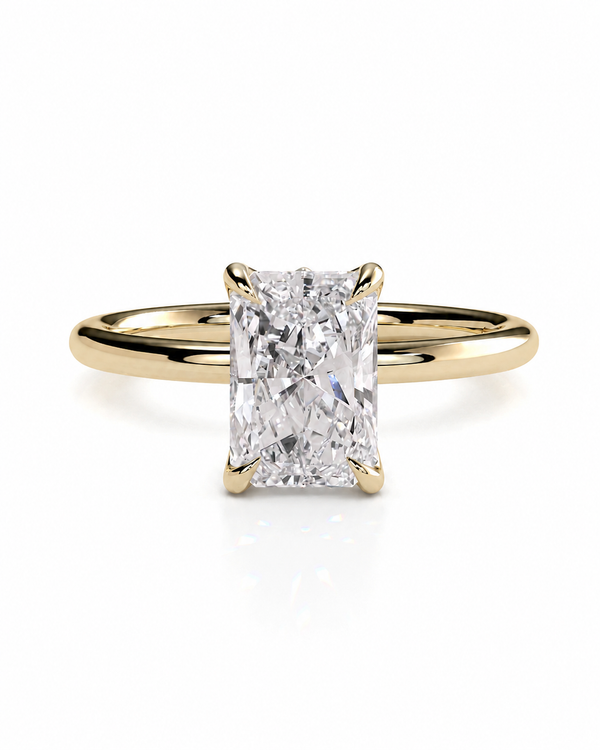 color_10K_YG, color_14K_YG &&A yellow gold solitaire engagement ring featuring a large rectangular radiant-cut diamond center stone, set against a clean white background.