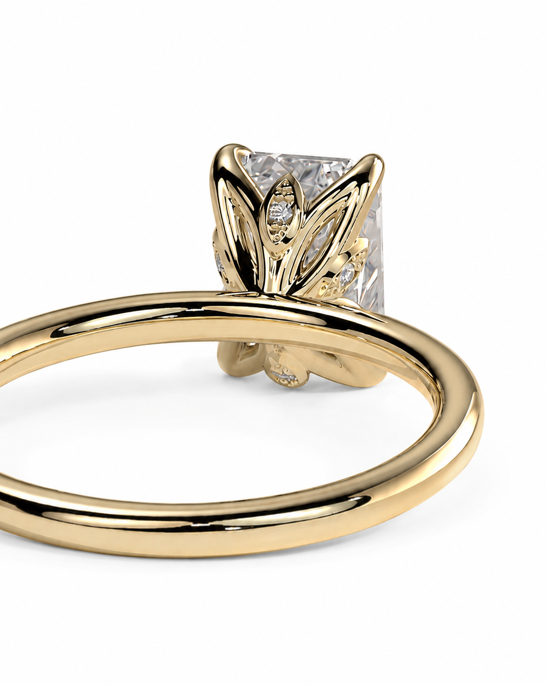 color_10K_YG, color_14K_YG &&A close-up shot of a yellow gold ring featuring a butterfly-shaped setting with a clear rectangular gemstone and small accent diamonds, set against a plain white background.