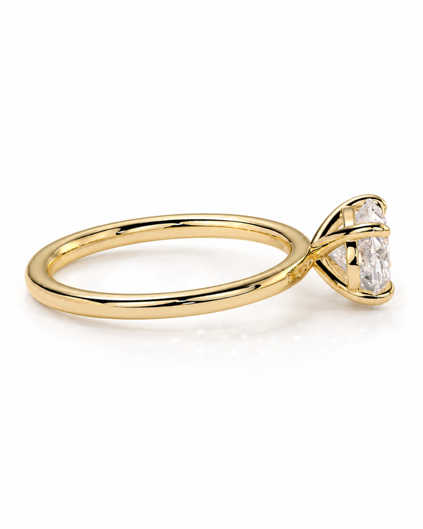 color_10K_YG, color_14K_YG &&A yellow gold solitaire engagement ring featuring a large oval-cut clear gemstone in a prong setting, shown on a clean white background.