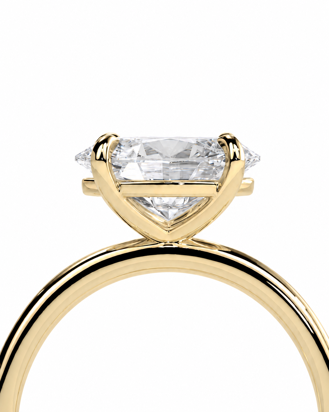 color_10K_YG, color_14K_YG &&A close-up of a yellow gold ring with a marquise-cut clear center stone and smaller side stones in a prong setting, shown against a plain white background.