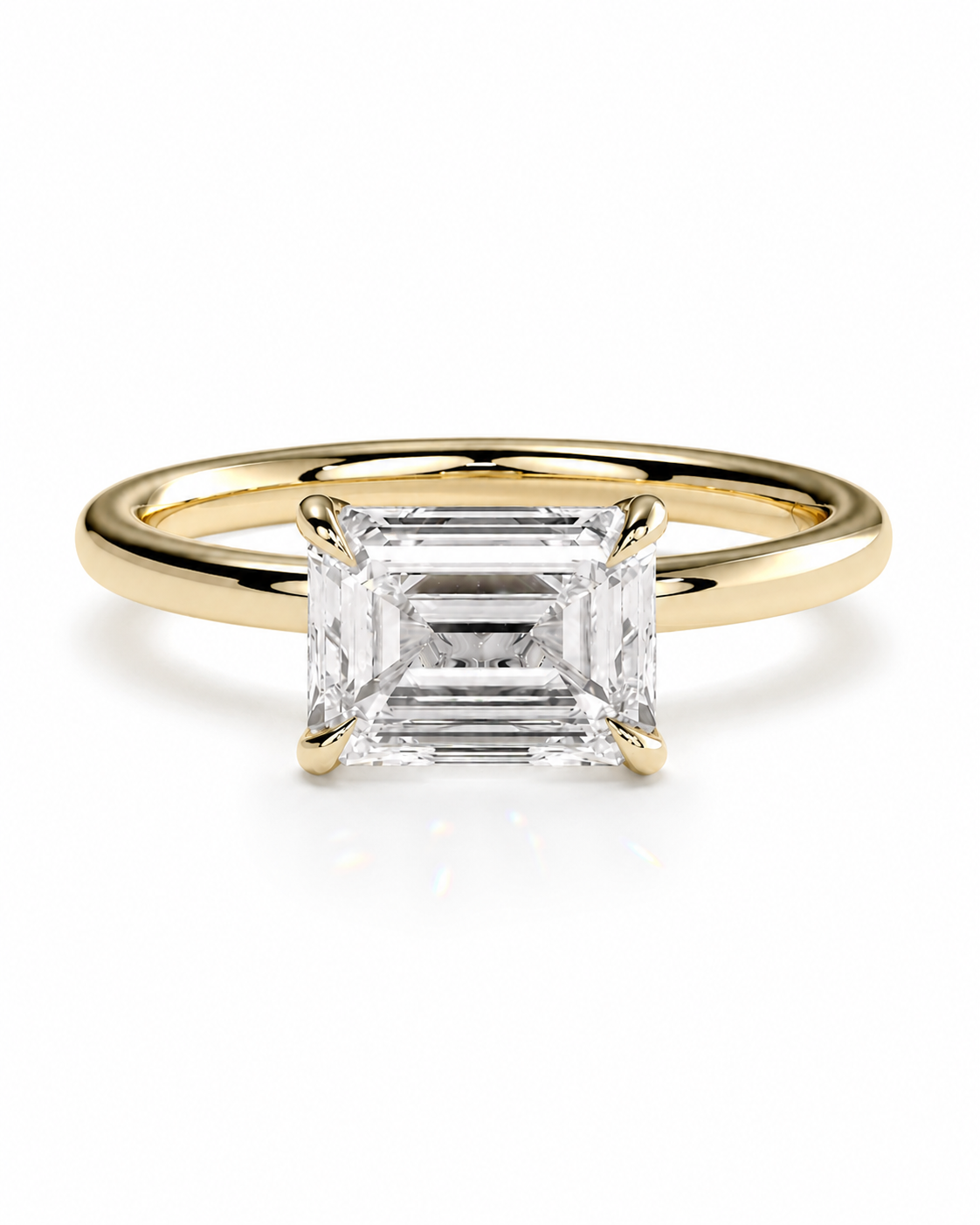 color_10K_YG, color_14K_YG &&A yellow gold ring featuring a large emerald-cut clear gemstone in a four-prong setting, shown on a clean white background.