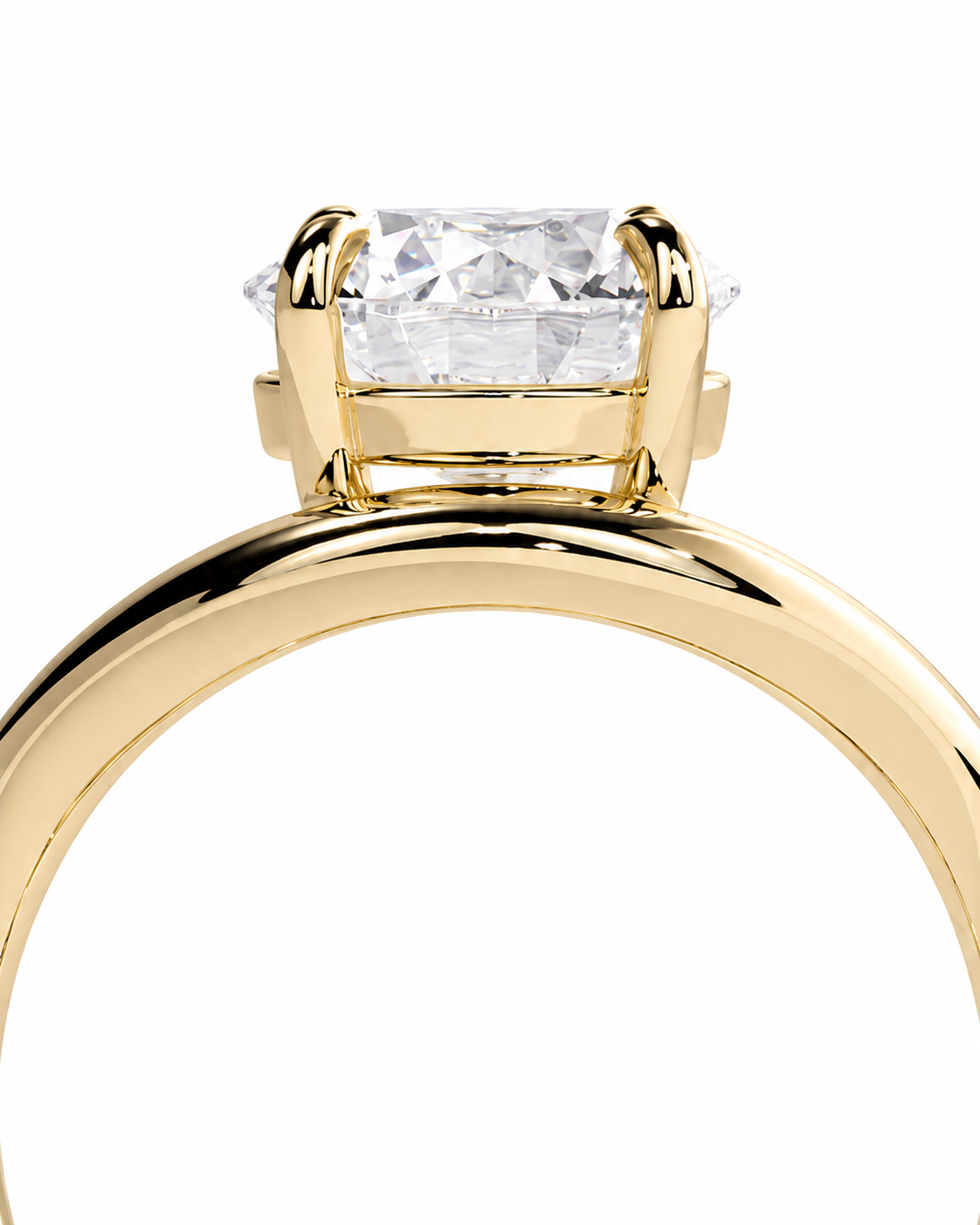 color_10K_YG, color_14K_YG &&A close-up shot of a yellow gold ring with a rectangular clear gemstone in a prong setting, shown against a solid white background.