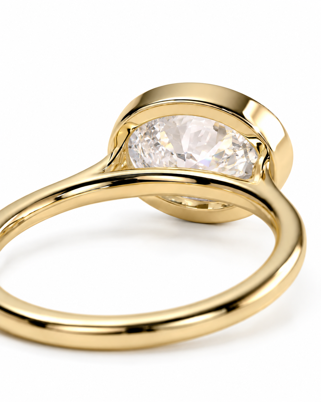 color_10K_YG, color_14K_YG &&A close-up shot of a gold ring featuring a marquise-cut clear gemstone in a bezel setting, shown against a plain white background.