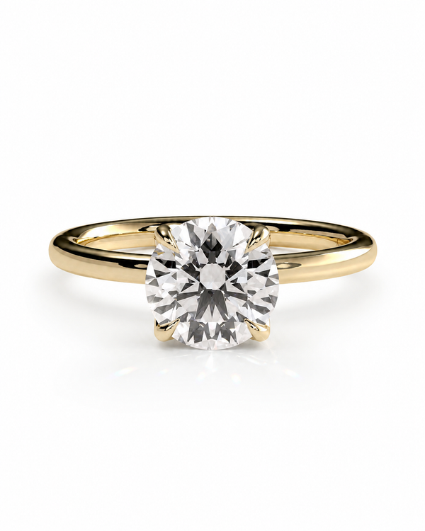 color_10K_YG, color_14K_YG &&A classic solitaire engagement ring featuring a round brilliant-cut diamond set in a yellow gold four-prong band, shown on a clean white background.